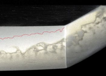 A tachi blade in Ichimonji style. Hamon Choji with utsuri. The photo shows a clear change in the structure of the steel in the utsuri area.